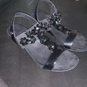 Black floral wedge sandals by Anne Klein Sport